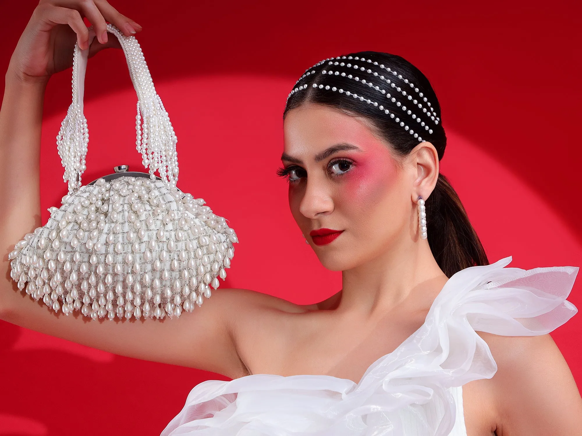 White Purse with handcrafted pearls detailing an ideal bridal bag