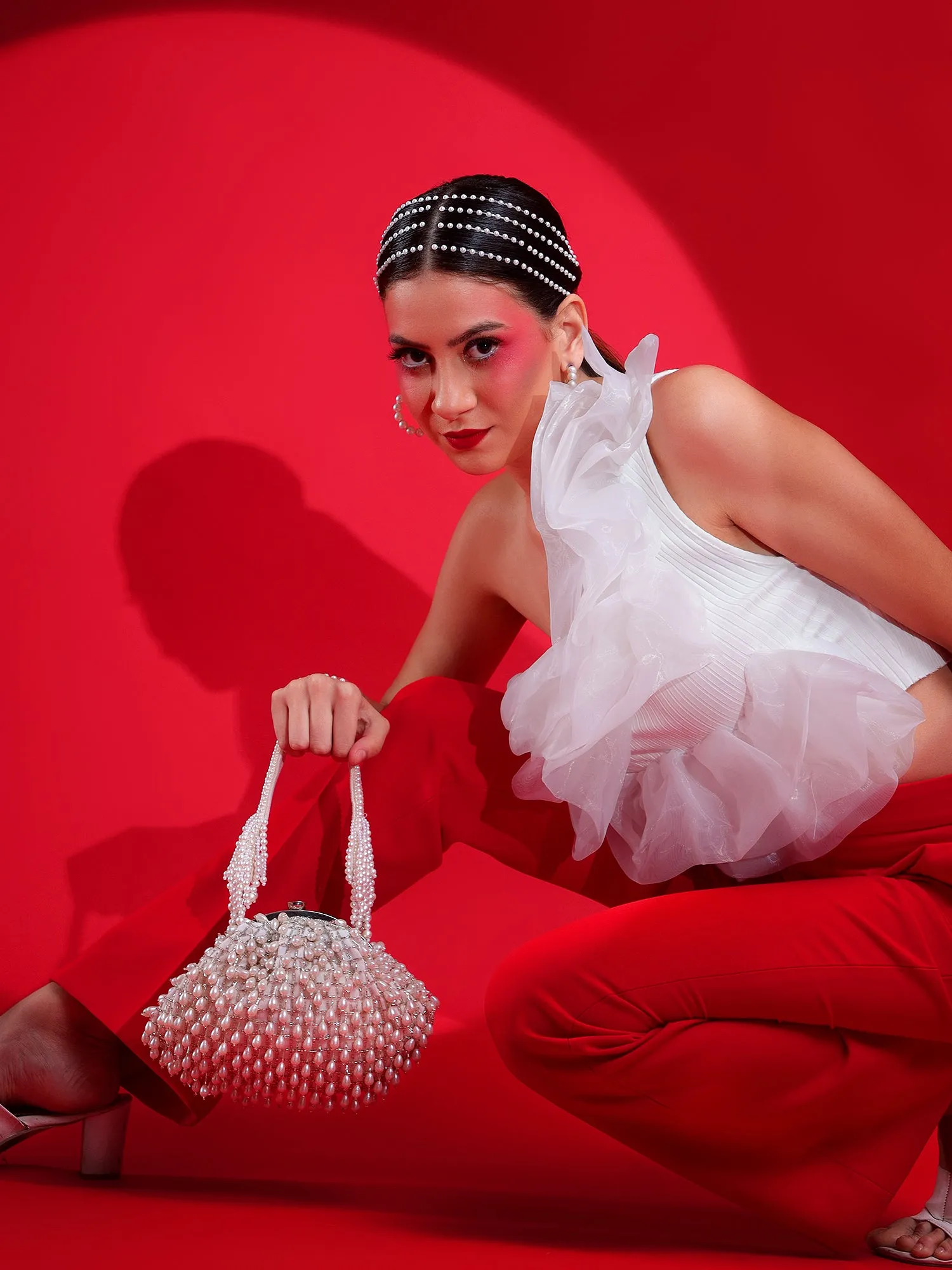 White Purse with handcrafted pearls detailing an ideal bridal bag